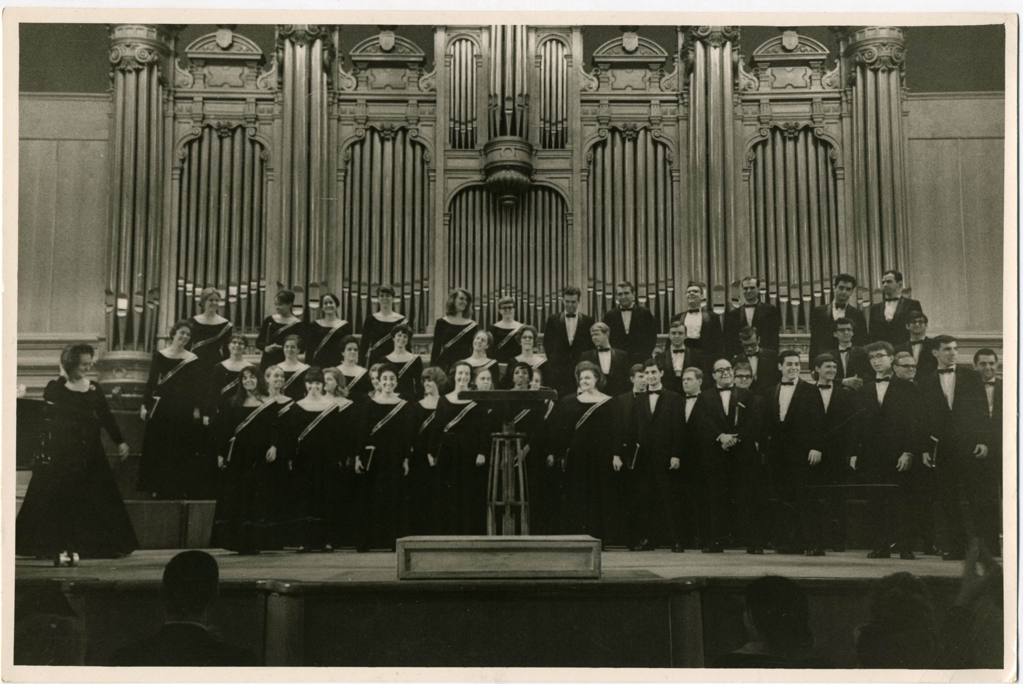 Lorna Cooke deVaron poses with the NEC Chorus in a concert hall in Moscow in 1966.