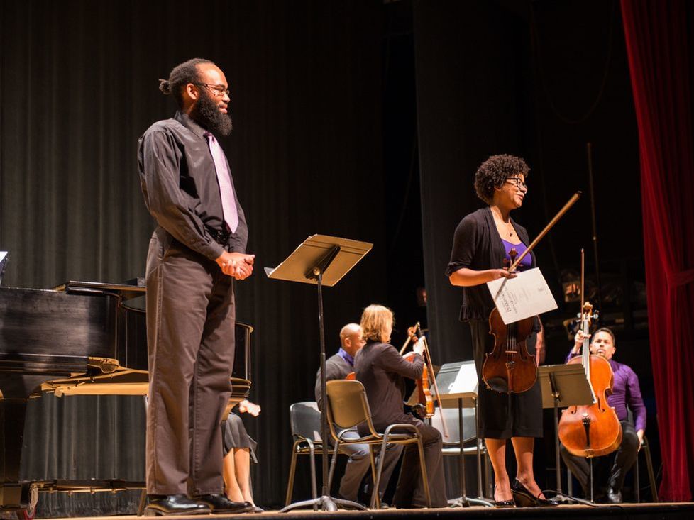 Anthony R. Green and Ashleigh Gordon on stage with a string quartet