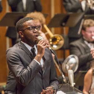 A jazz vocalist performs with the N E C Jazz Orchestra