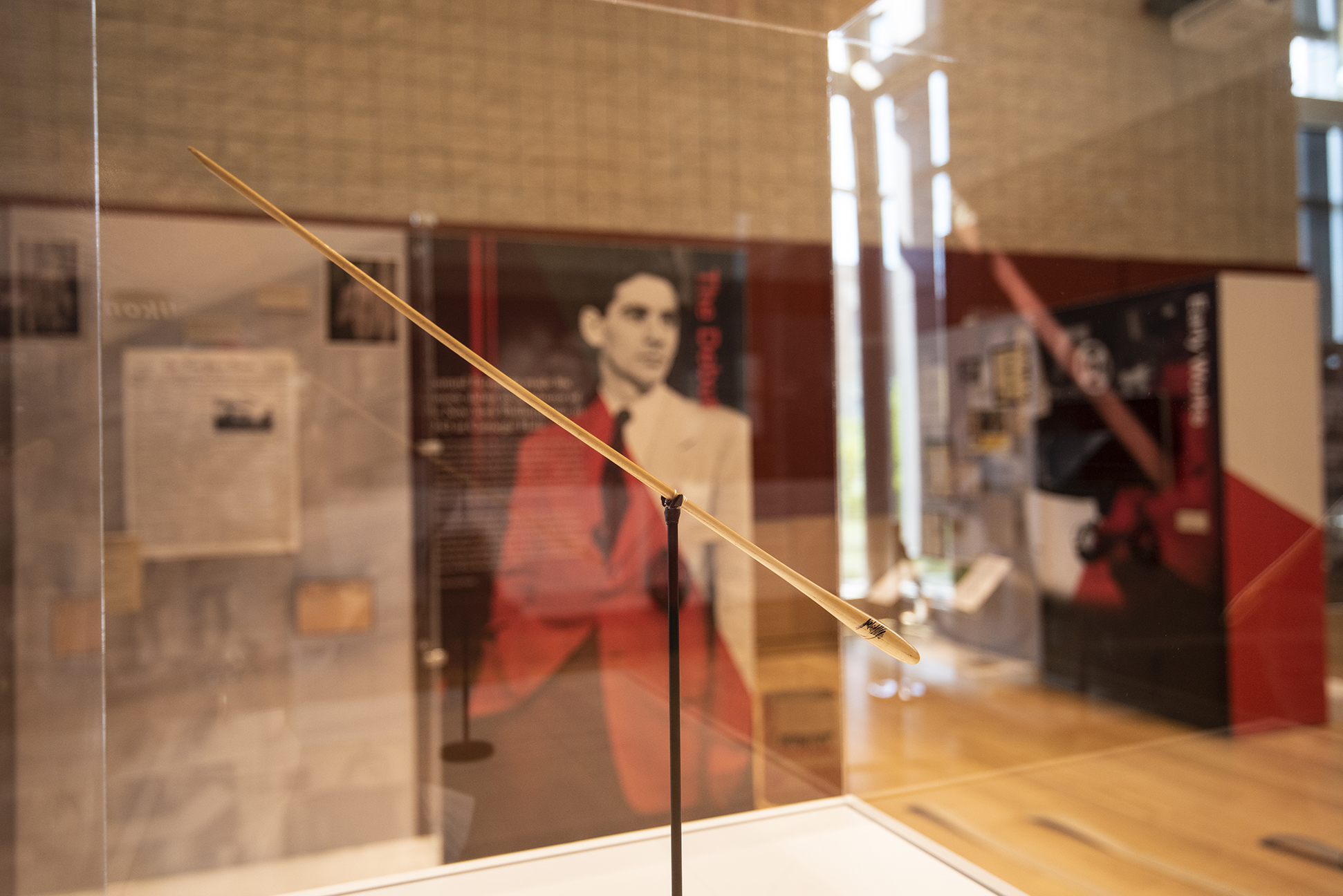 A photo of a conductor baton on display in the Leonard Bernstein at 100 exhibit.