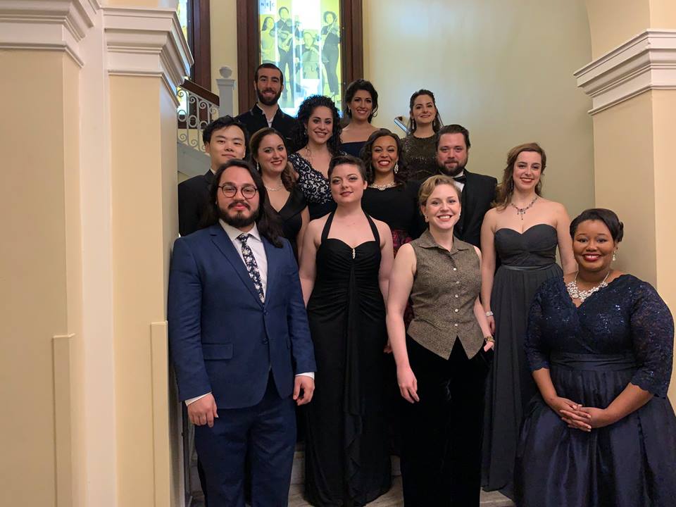 2019 Met Regional Competition winners smile and pose in a staircase in Jordan Hall
