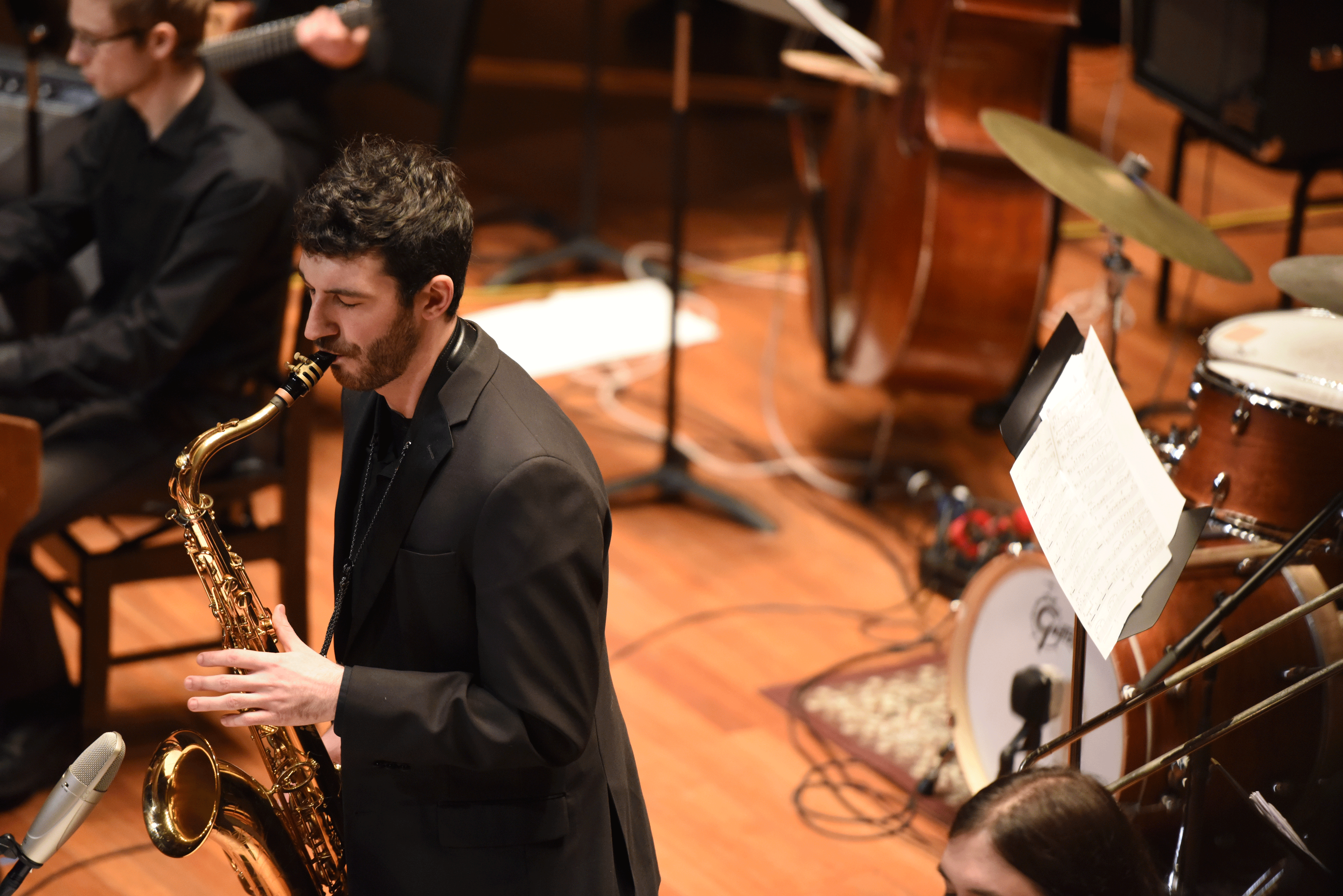 Michael Talento plays the saxophone with the NEC Jazz Orchestra
