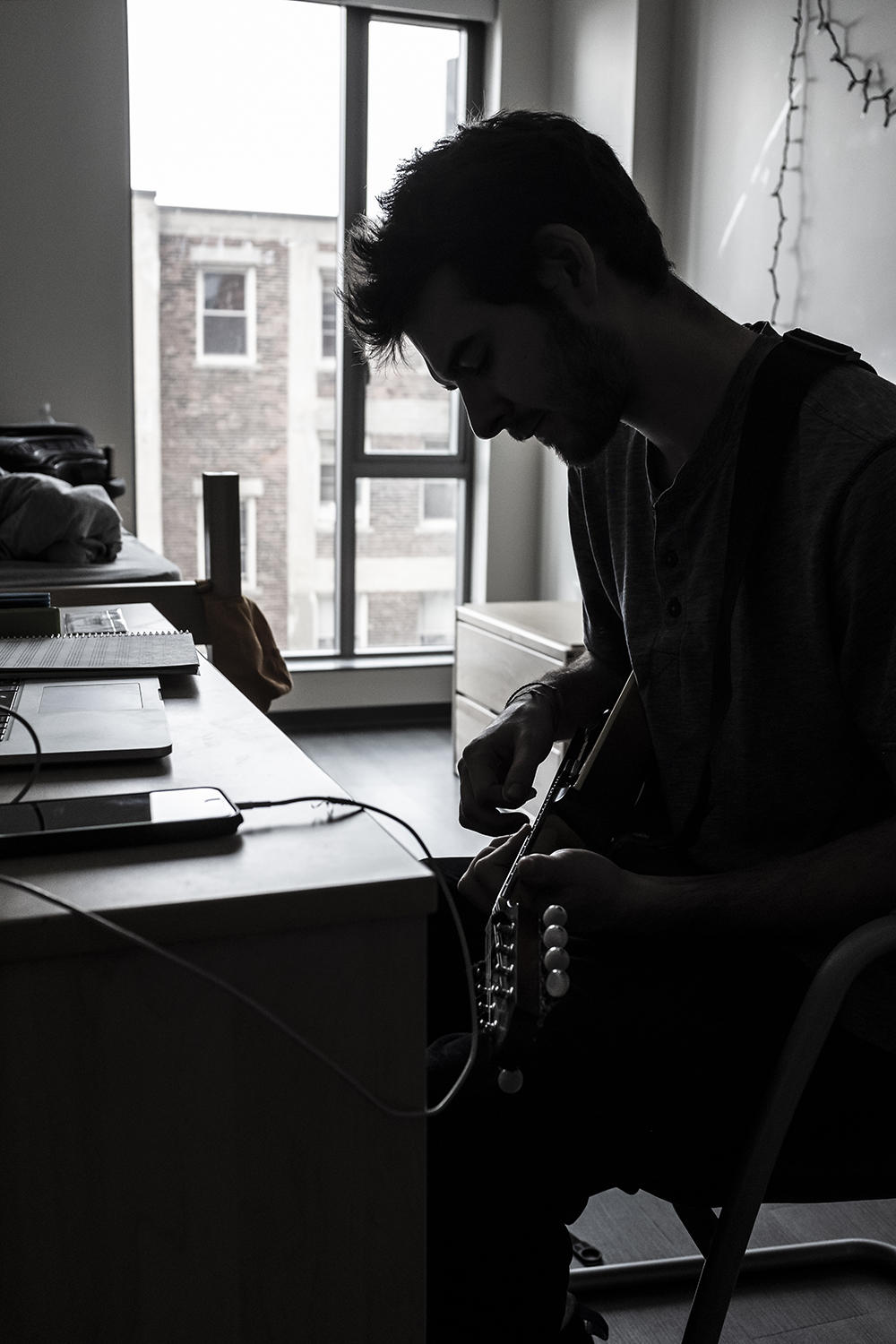 Student practicing in his dorm room
