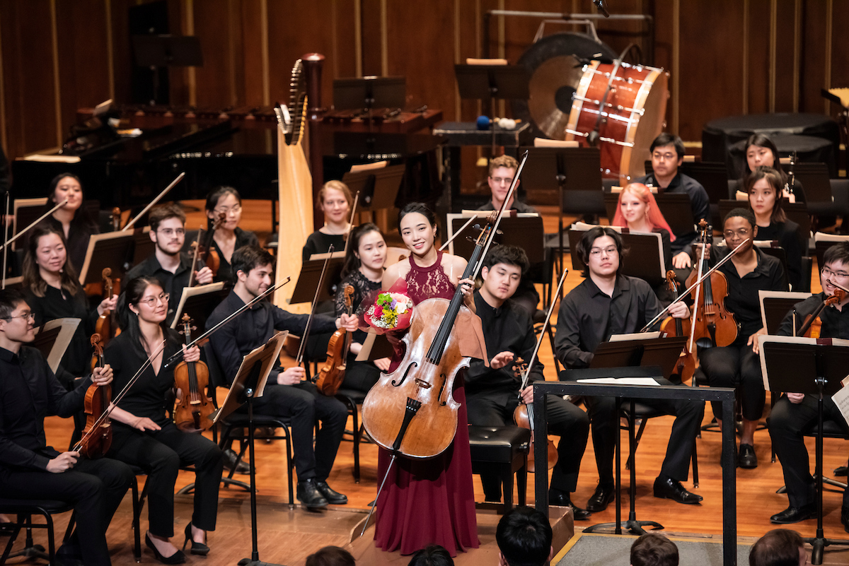 Claire Deokyong Kim smiles and receives applause after her performance of Shostakovich’s Concerto No. 1 in E–flat Major with NEC Philharmonia as the winner of NEC's 2019 spring concerto competition.