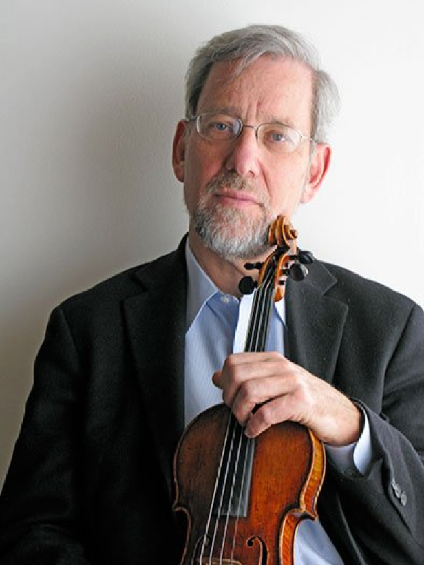 Paul Biss holding his violin