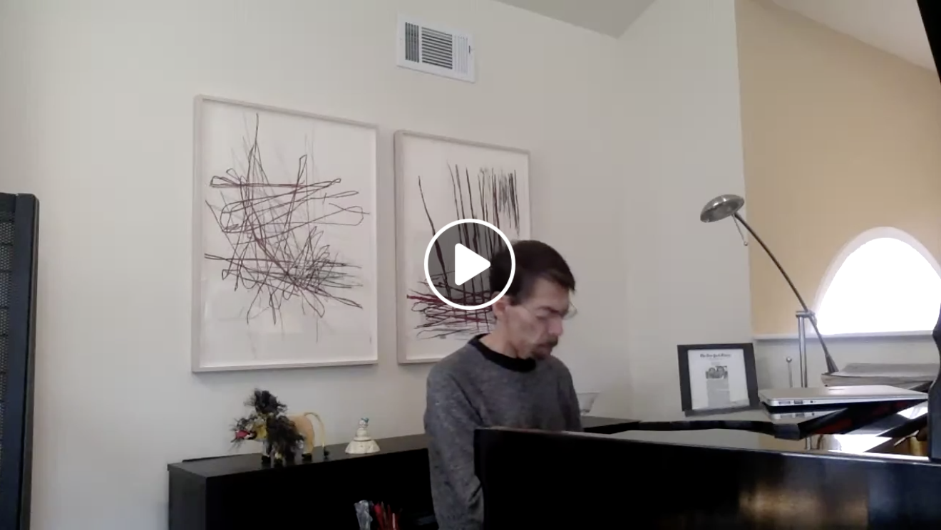 Fred Hersch sits at his piano at home