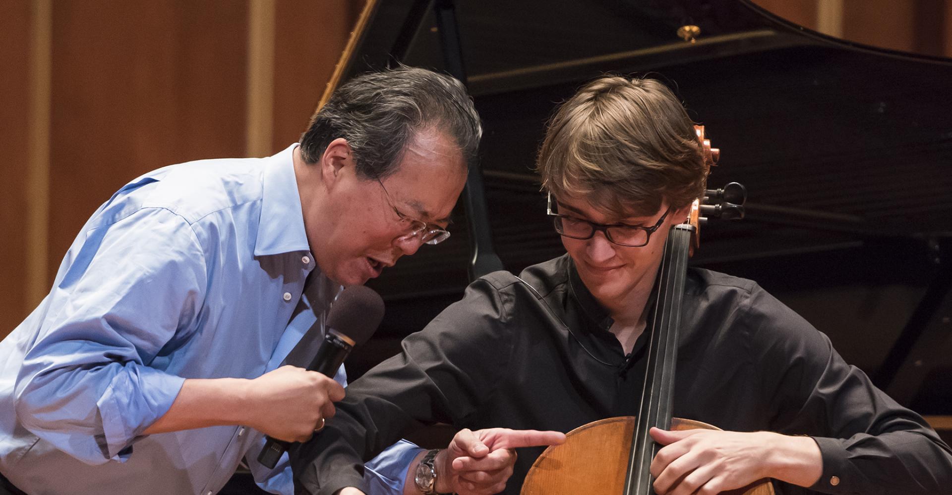 Yo-Yo Ma works with a student cellist during a masterclass