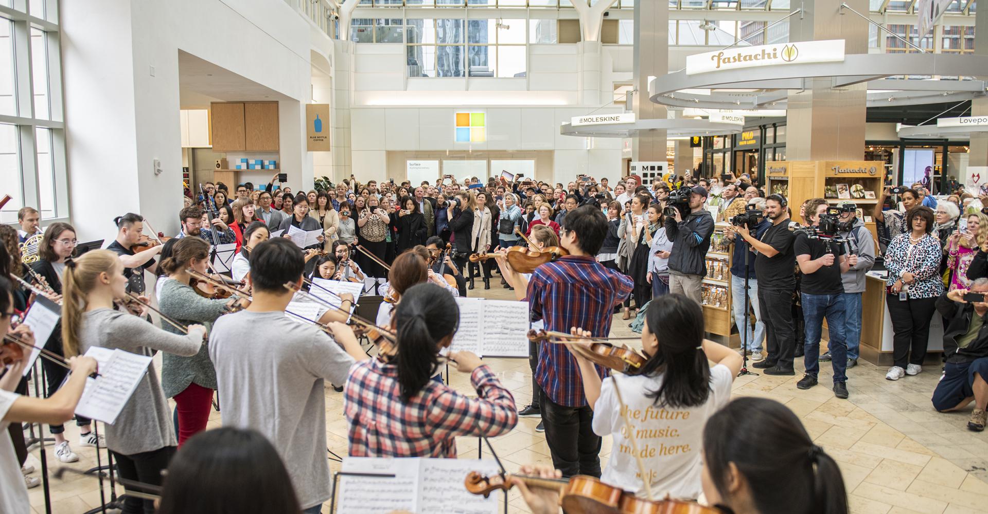 The flash mob orchestra plays