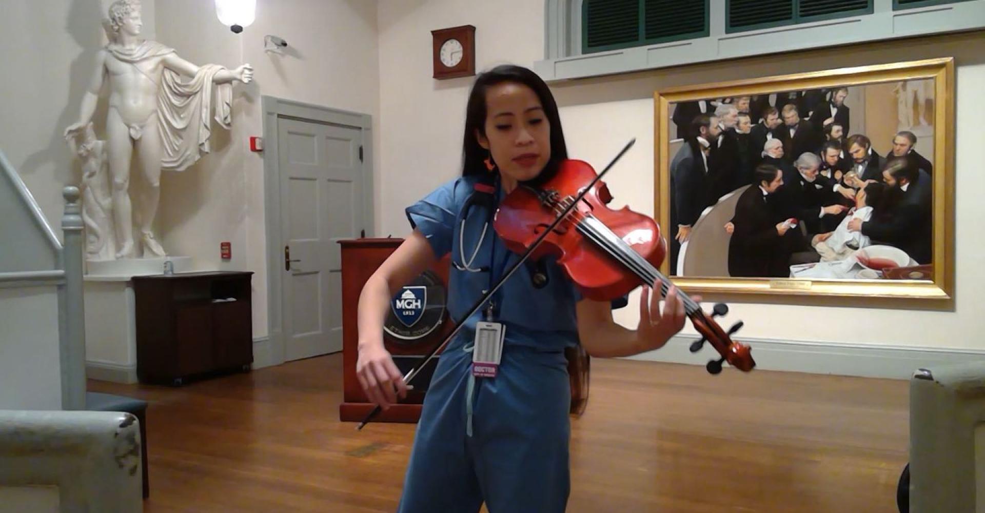 Dr. Kathy May Tran practiced her instrument while on break at MGH.