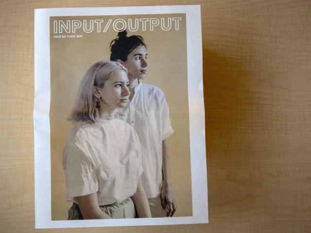 photo of the cover of Input/Output magazine, featuring two people looking to the side