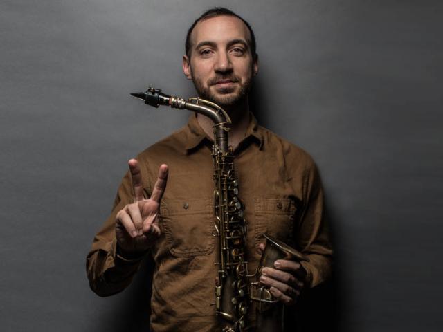 Alex LoRe with saxophone