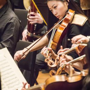 A violist performs with the NEC Symphony