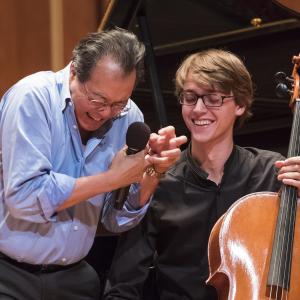 Yo-Yo Ma works with a student cellist during a masterclass