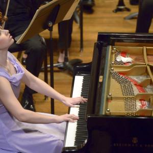 A pianist performs a concerto with the N E C Symphony
