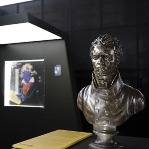 A bust of Beethoven, with an Andy Warhol print of Beethoven in the background