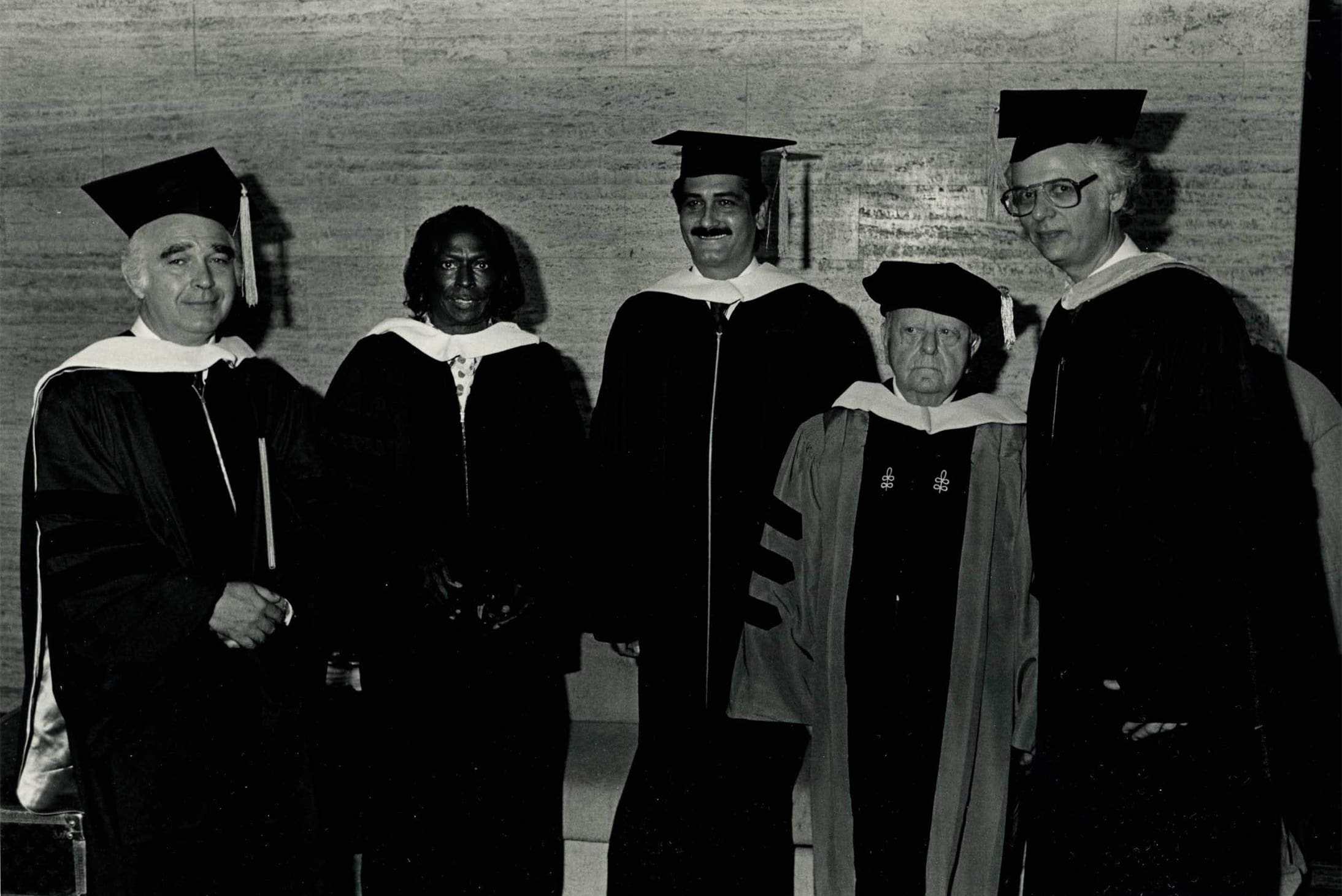 NEC Commencement, 1986: Justino Díaz, center, and fellow honorary degree recipients Joseph Silverstein, Miles Davis, and Virgil Thomson, with NEC president Laurence Lesser. Photo by Paul Foley.