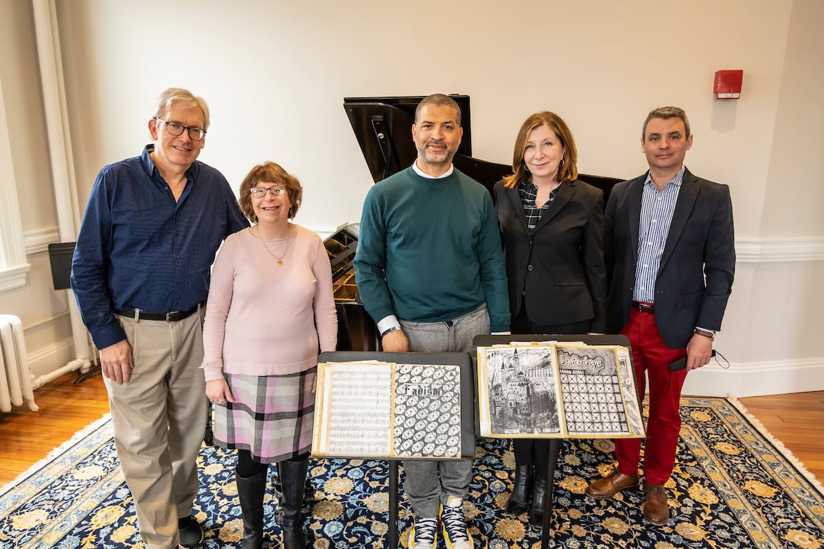 Jason Moran hands off his collection of musical scores, compositions, exercises, and drawings by former faculty Jaki Byard to the NEC Library, in the presence of President Andrea Kalyn, Provost Ben Sosland, NEC Archivist Maryalice Perrin-Mohr, and Jazz Studies chair Ken Schaphorst.
