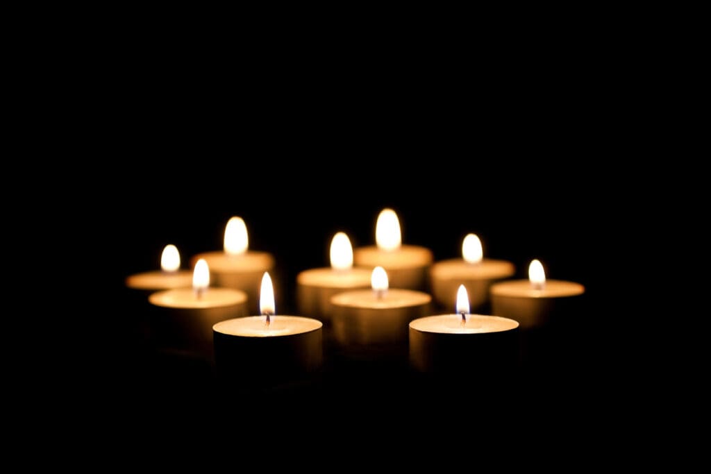 Burning candles on a black background