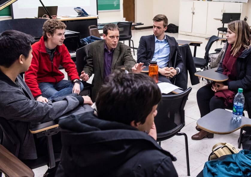 Professor Matthew Duveneck leads students of his Forest Ecology class in discussion.