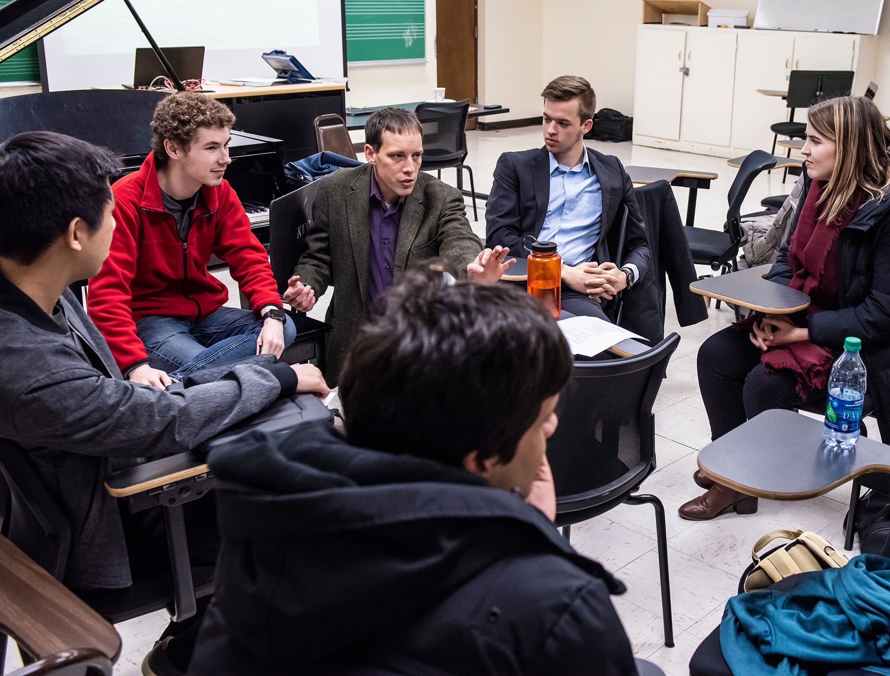 Professor Matthew Duveneck leads students of his Forest Ecology class in discussion.