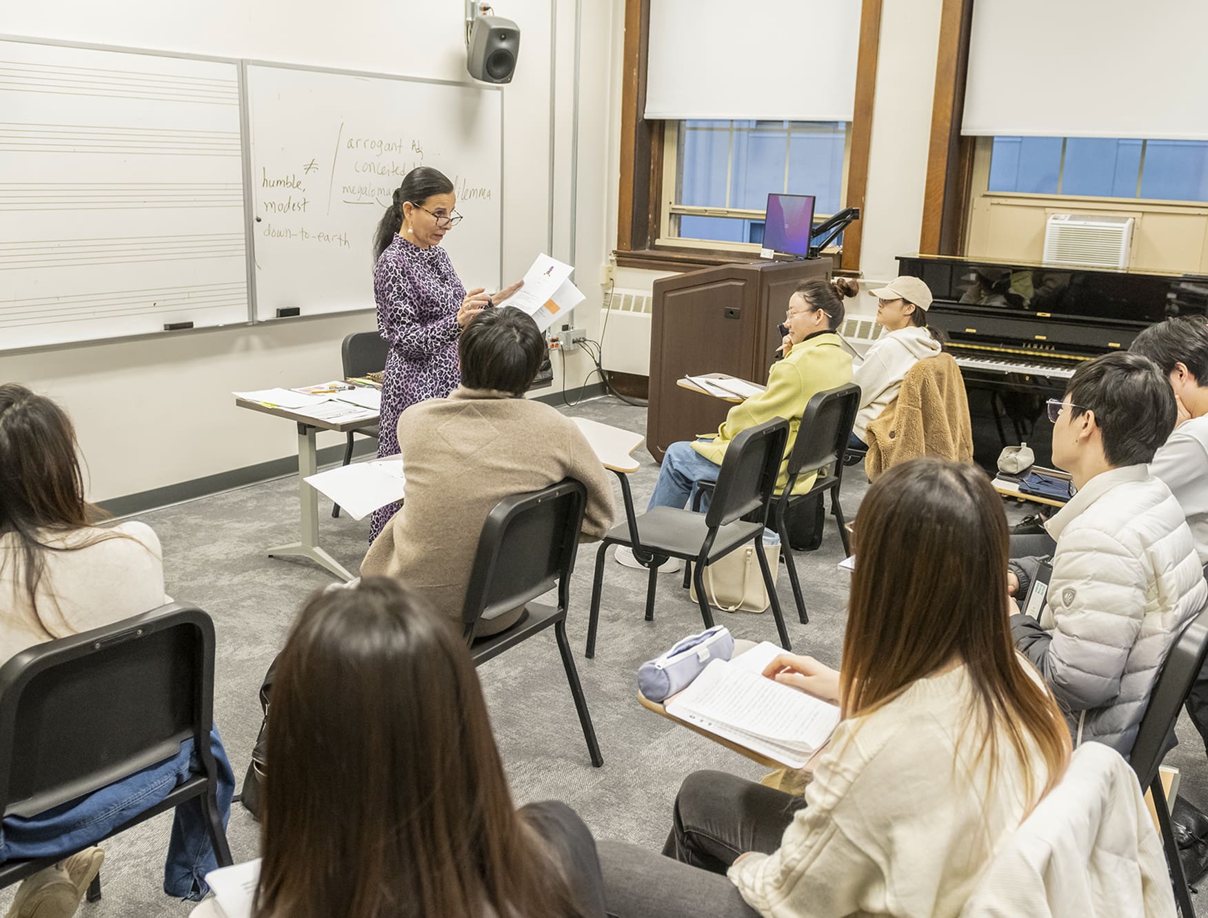 Teacher facing a classroom of students.
