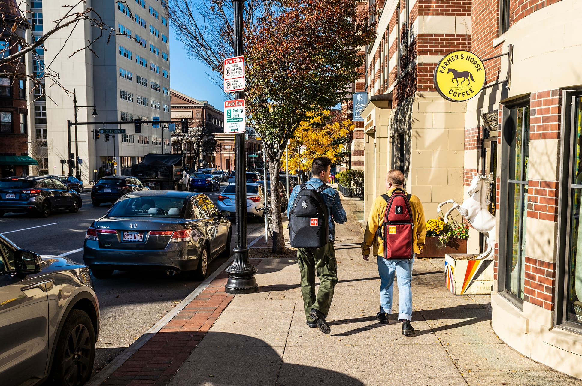Two NEC students walking down a street in Boston.