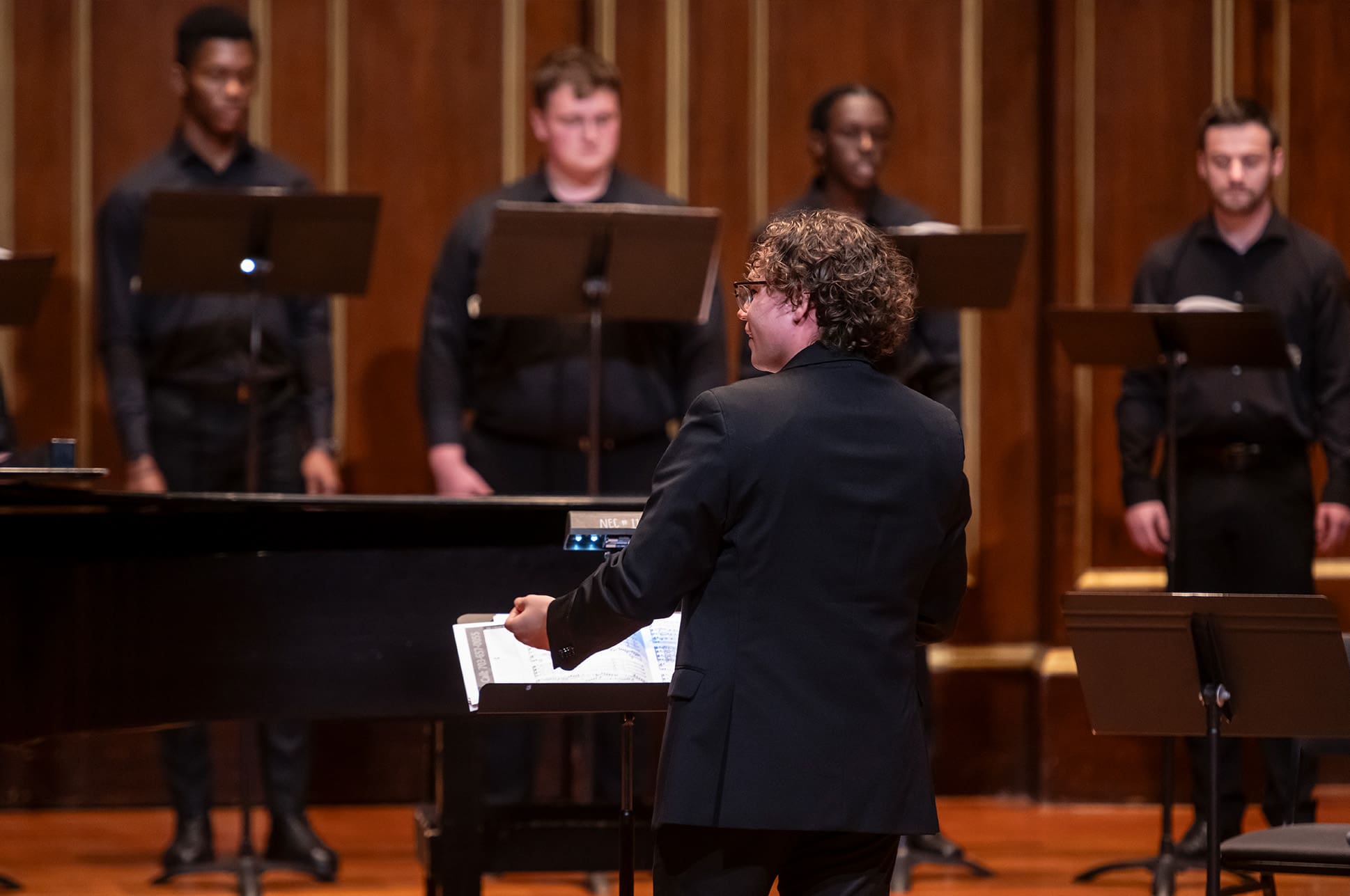 A choral conductor on the Jordan Hall stage
