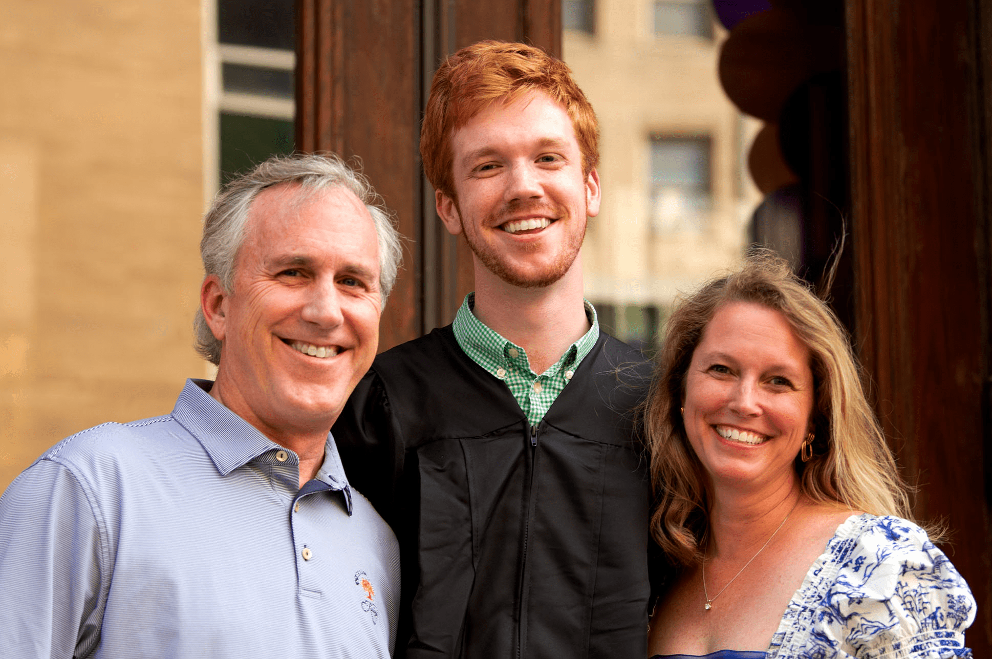 An NEC student with his parents