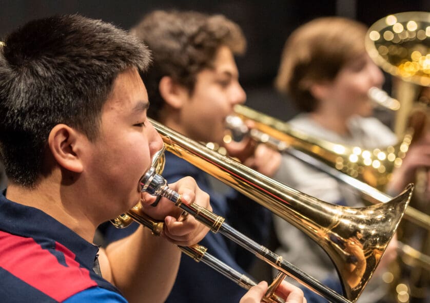 Young students playing in a brass ensemble.