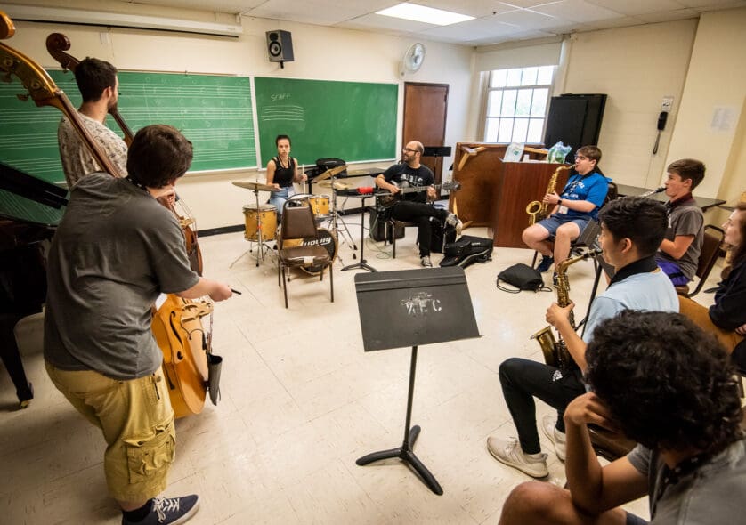 Students in a classroom playing in a jazz ensemble.
