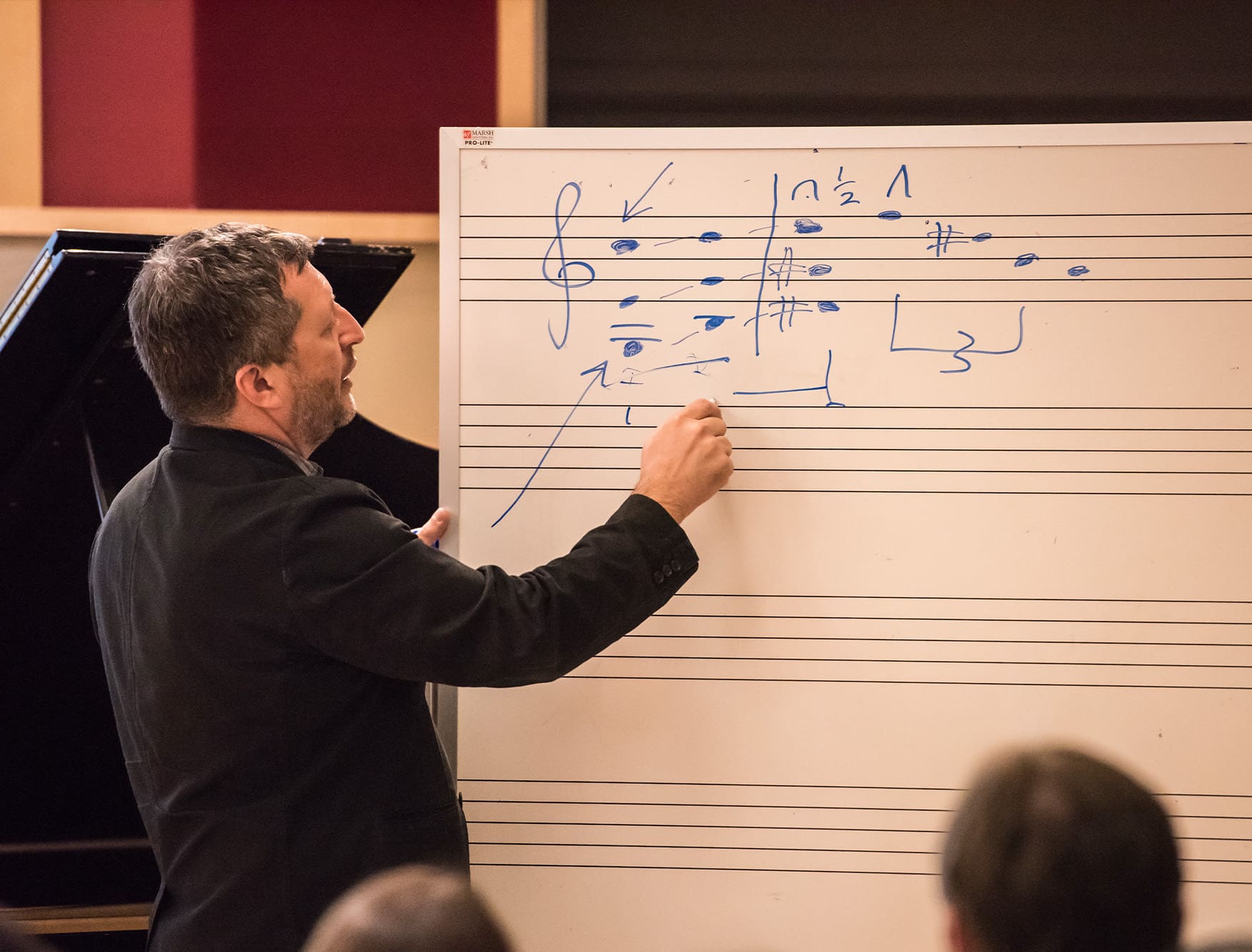 Writing music notes on whiteboard