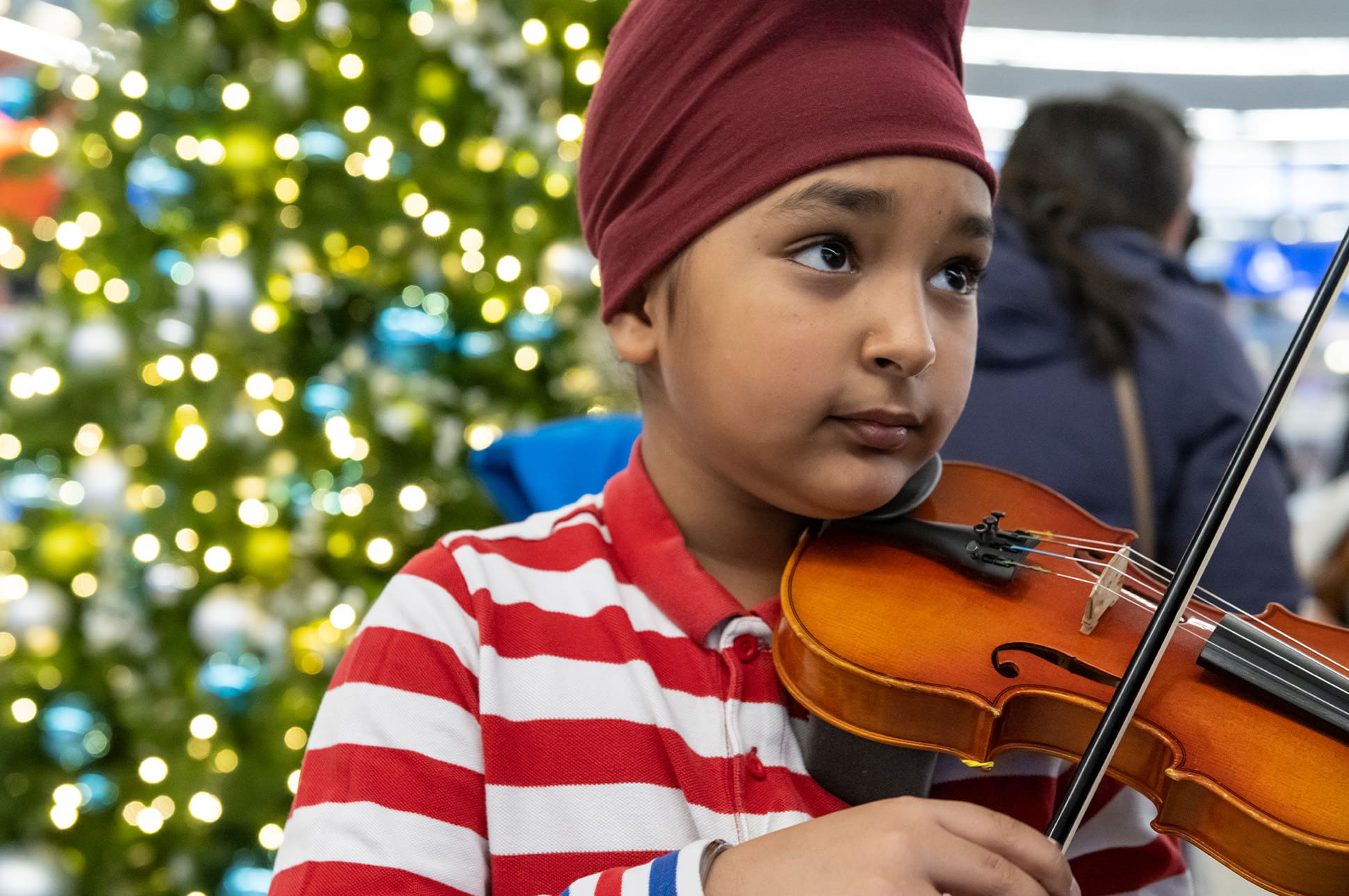 Young student playing the violin.