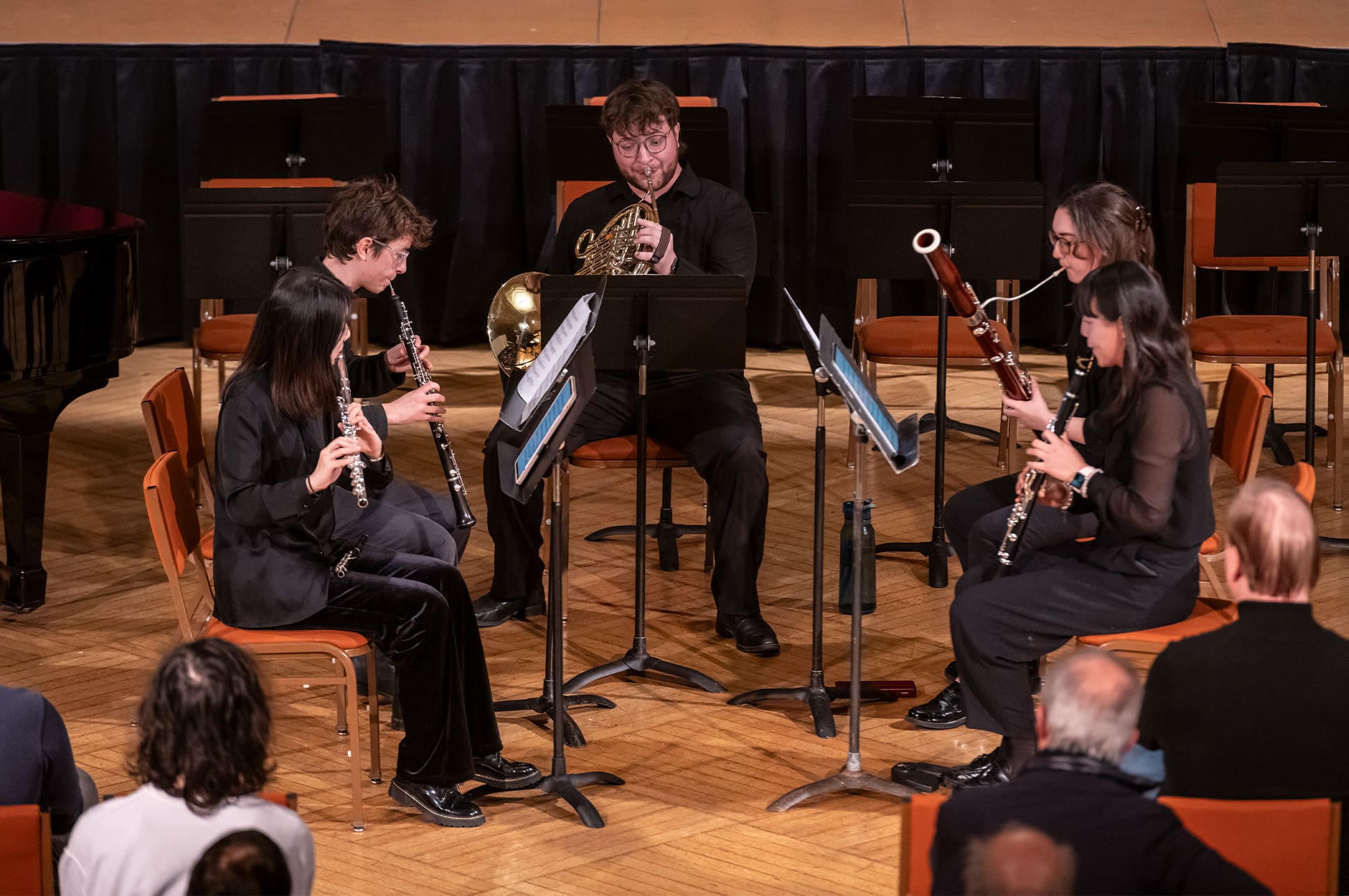 Small ensemble dressed in black performing