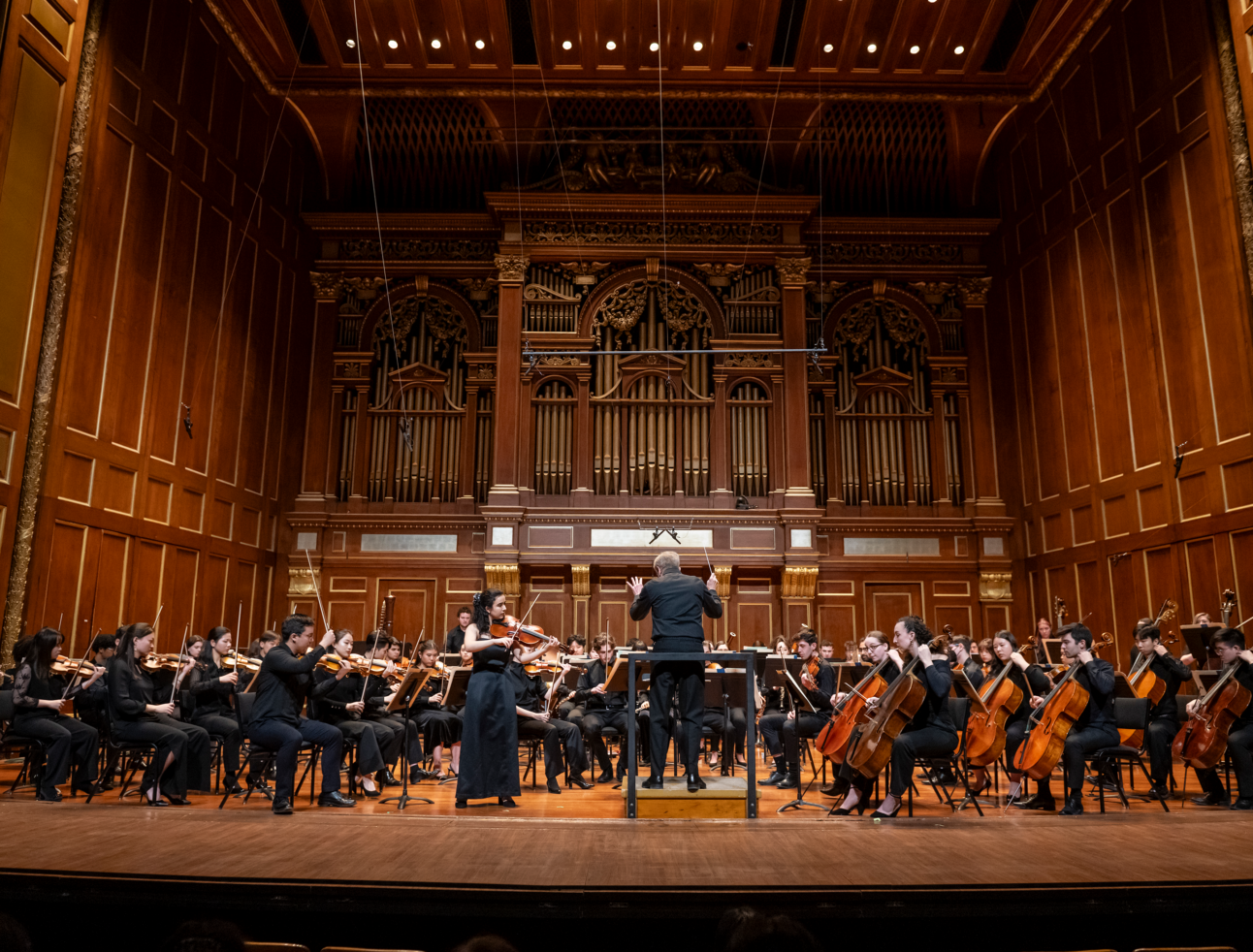 Hugh Wolff conducts the NEC Philharmonia with Concerto Competition winner Cara Pogossian '24 GD, viola. 30 January 2024, Jordan Hall. Shown: Cara Pogossian, viola soloist.