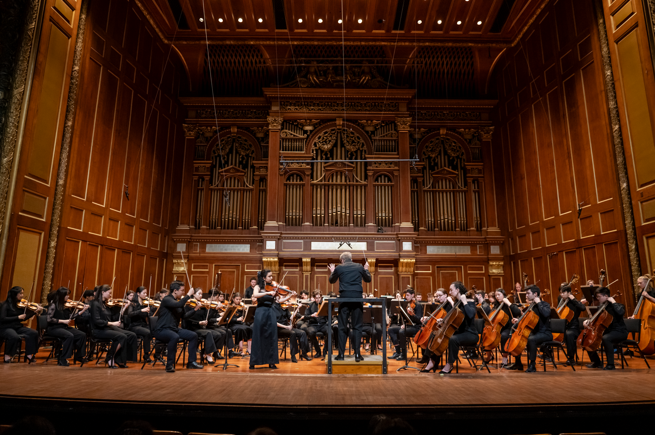 Hugh Wolff conducts the NEC Philharmonia with Concerto Competition winner Cara Pogossian '24 GD, viola. 30 January 2024, Jordan Hall. Shown: Cara Pogossian, viola soloist.