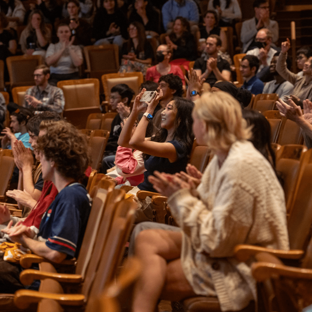 Audience Members applauding