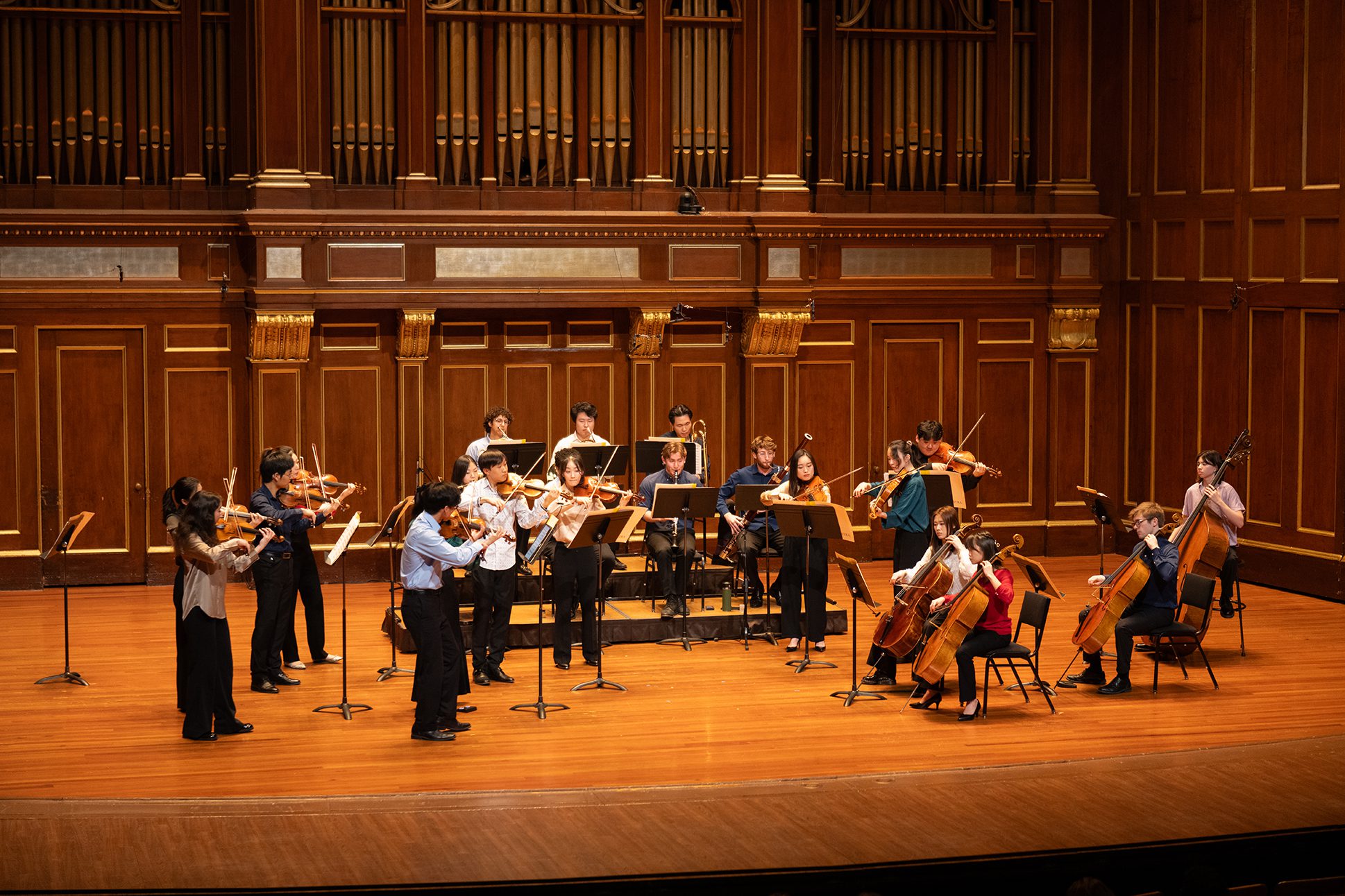 The NEC Chamber Orchestra performing the works of Ives, Seeger, and Haydn in Jordan Hall.
