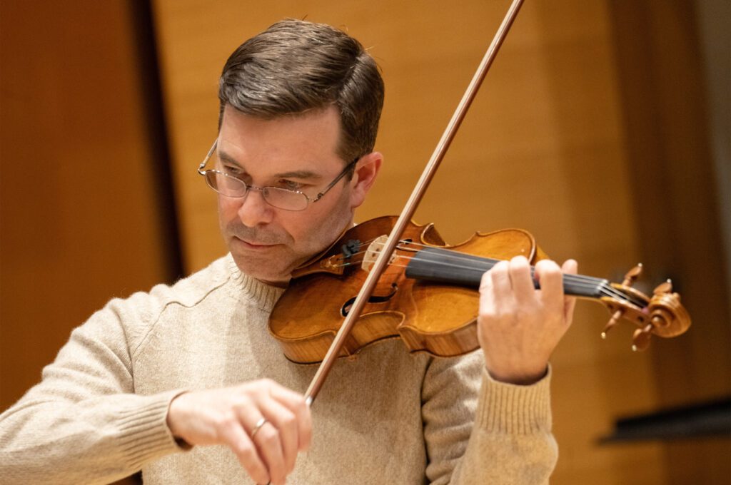 Nathan Cole playing violin.