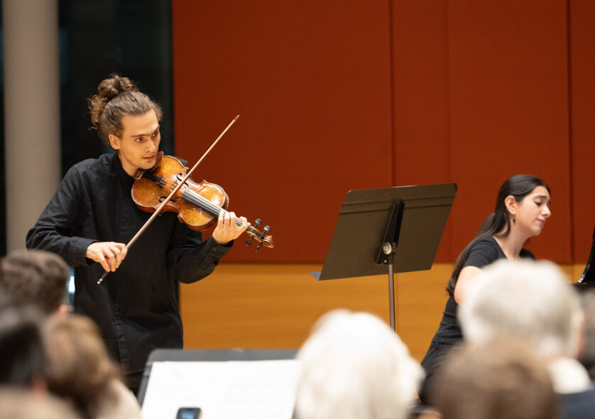 Student playing a violin.