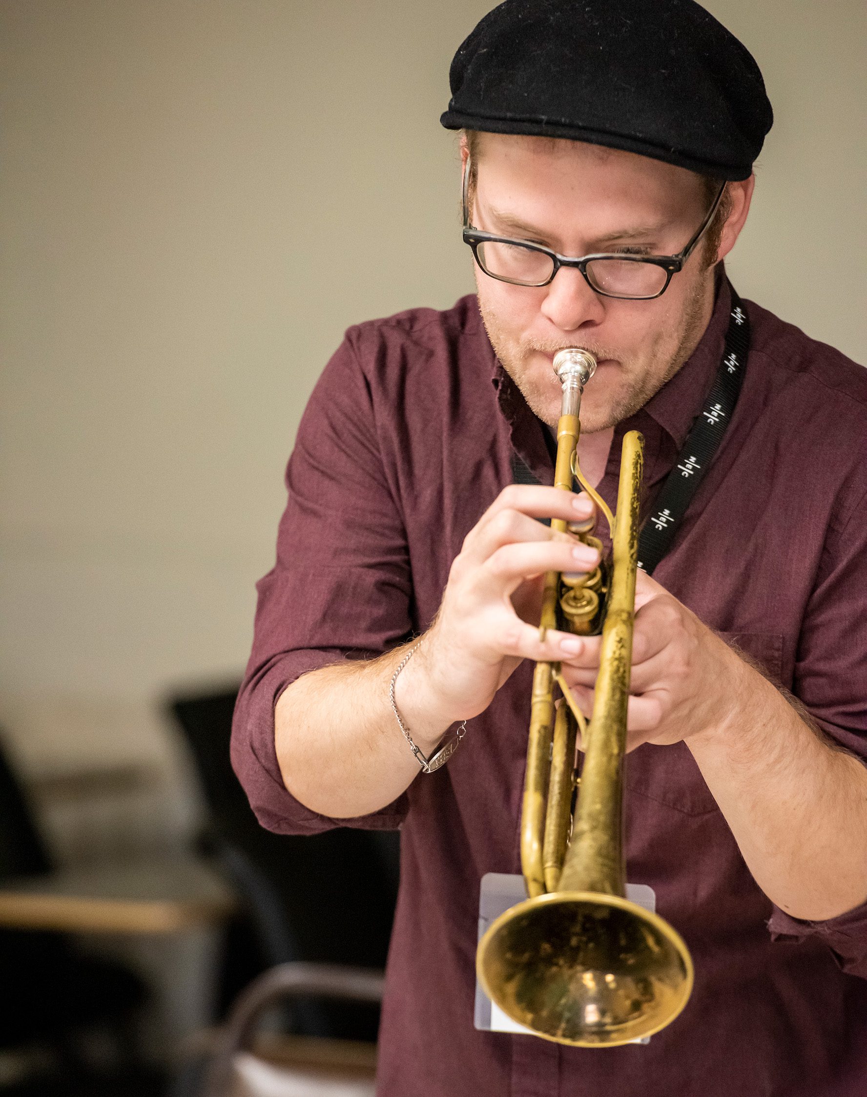 Person playing a trumpet.