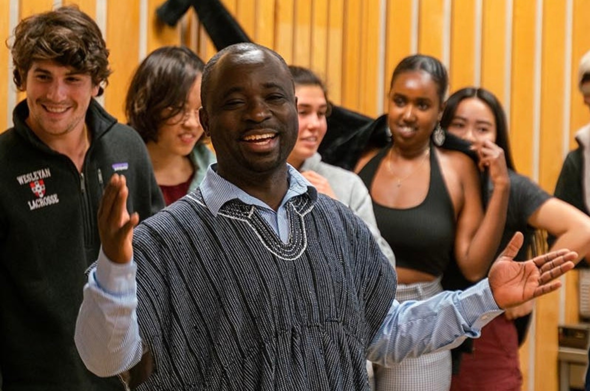 Ethnographer and performer John Dankwa singing with students.