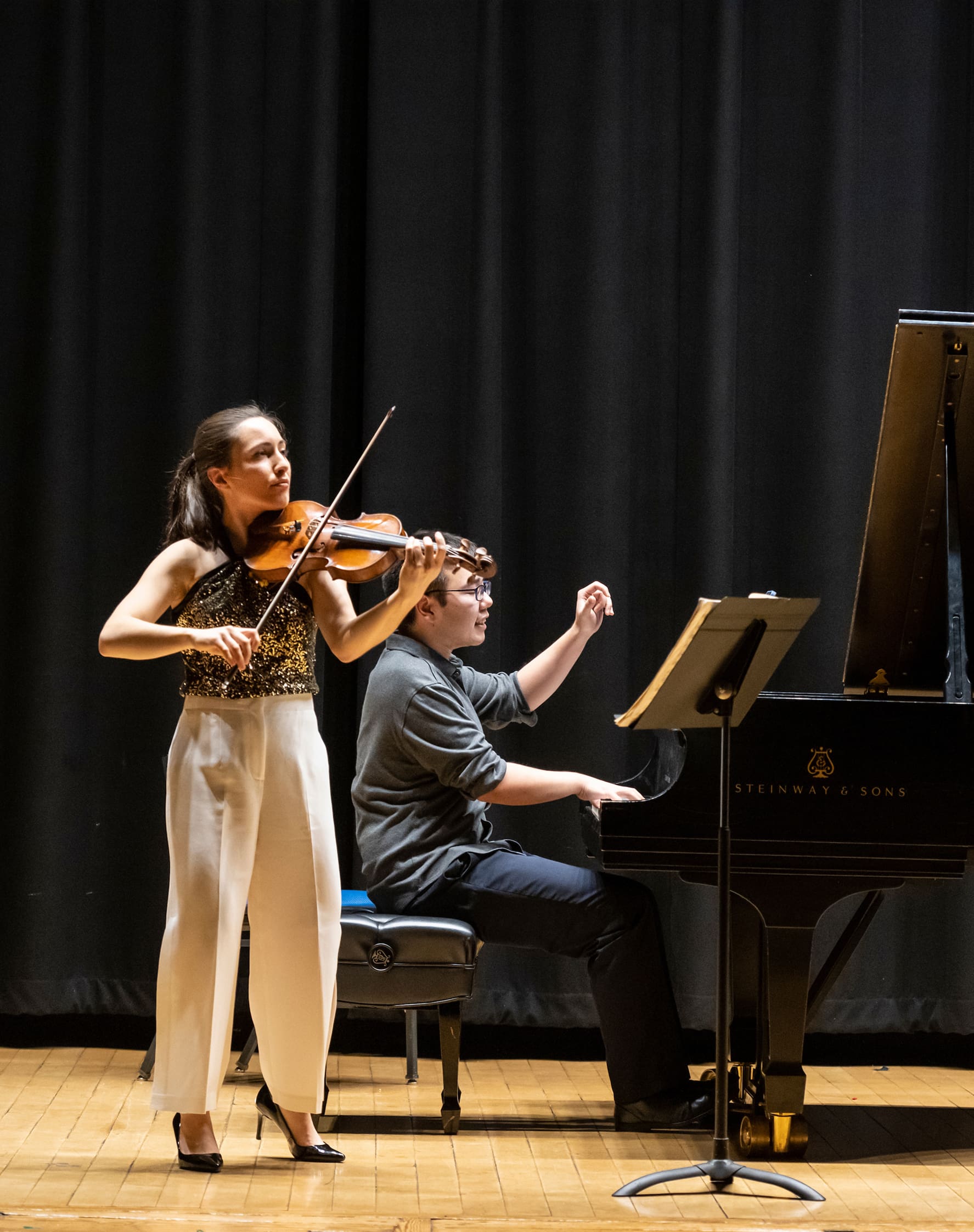 Chamber-Music-For-Pianists-Vertical A violinist and a pianist performing on stage in Williams Hall.