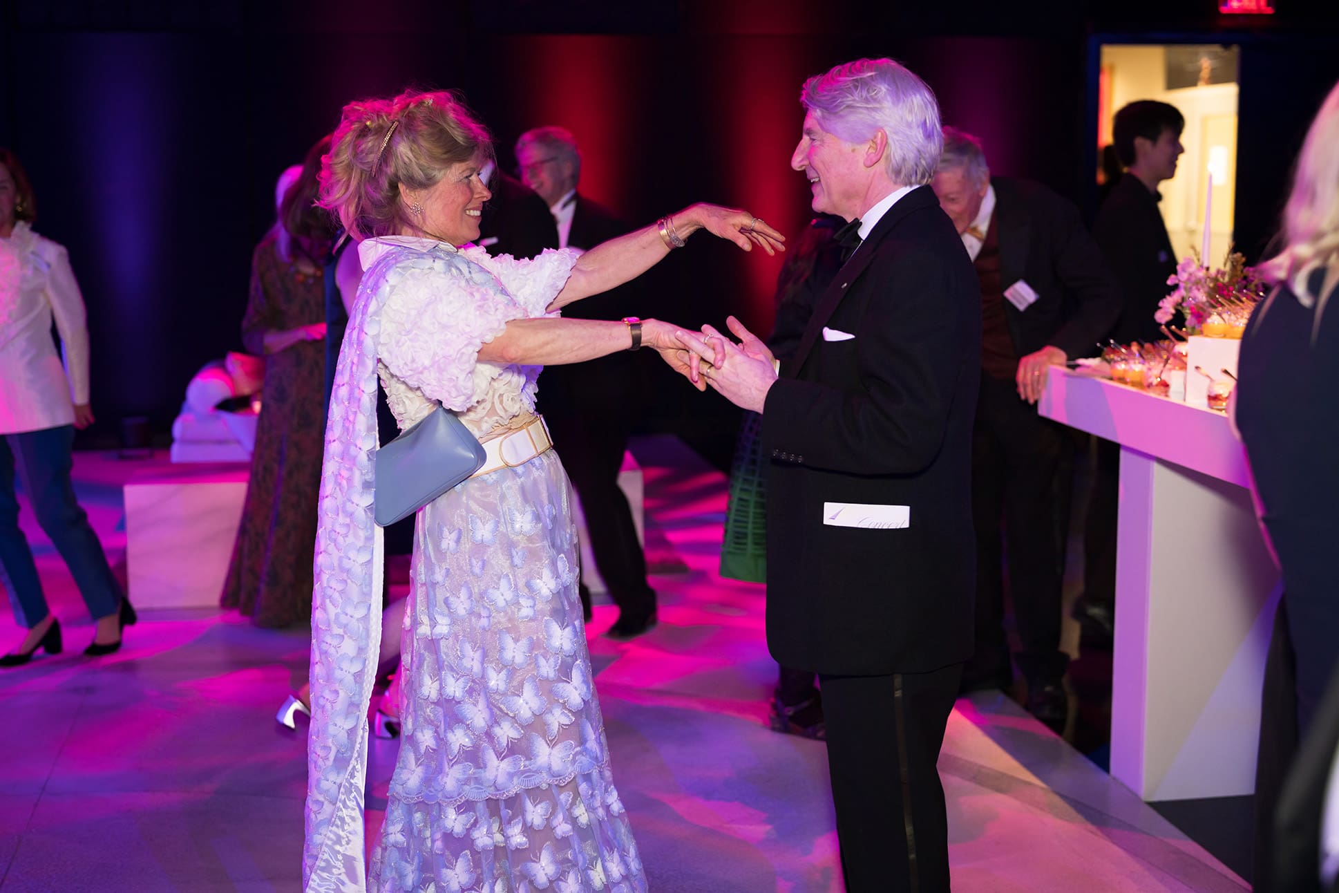 Two people dancing wearing formal clothing at the annual scholarship gala.