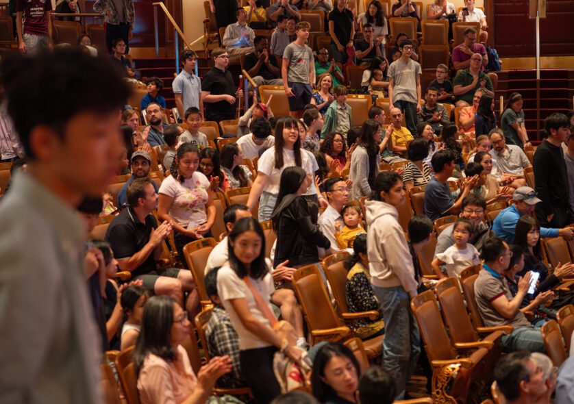 Students and families gather in Jordan Hall at the start of the day.