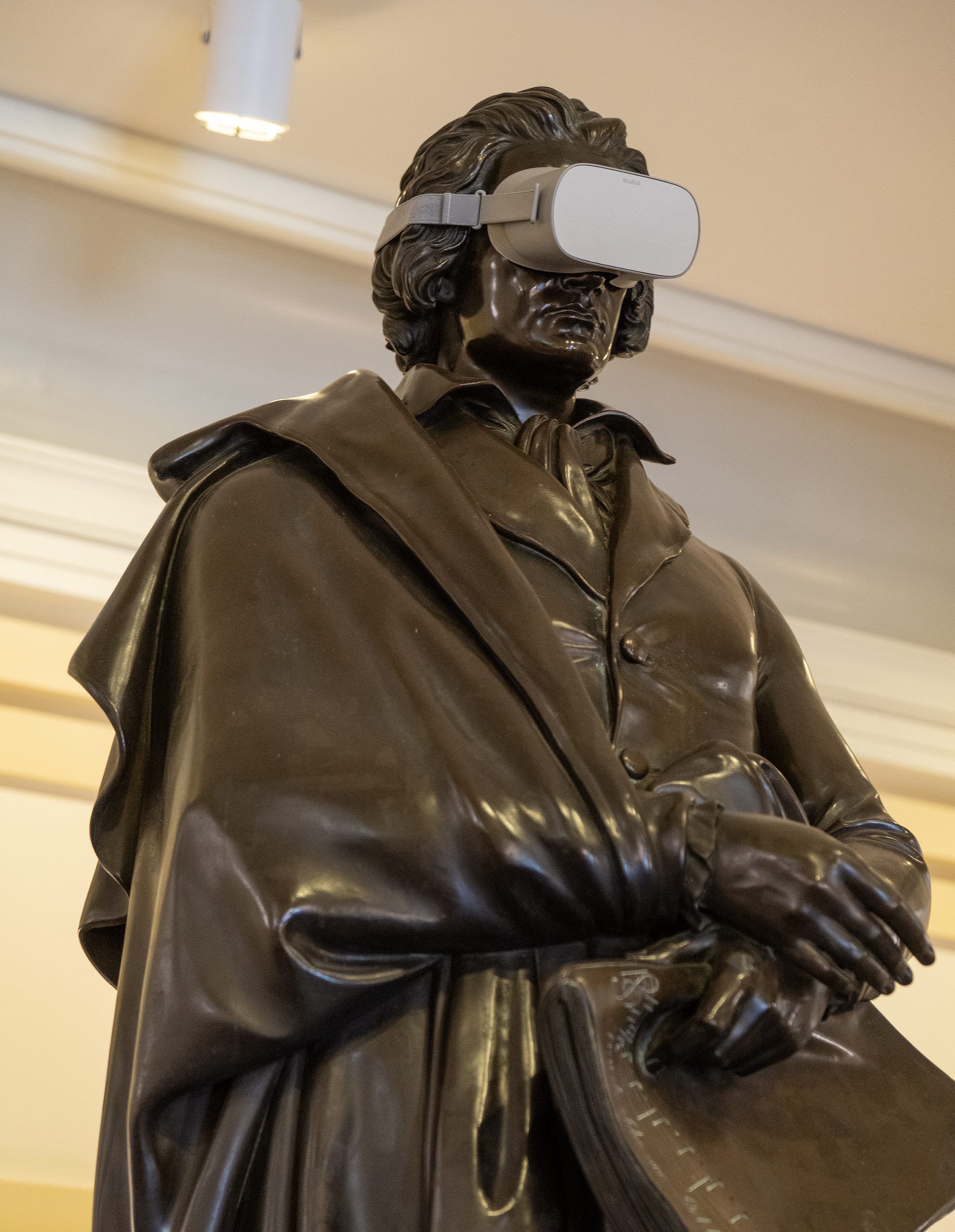 Statue of Beethoven with VR goggles on.