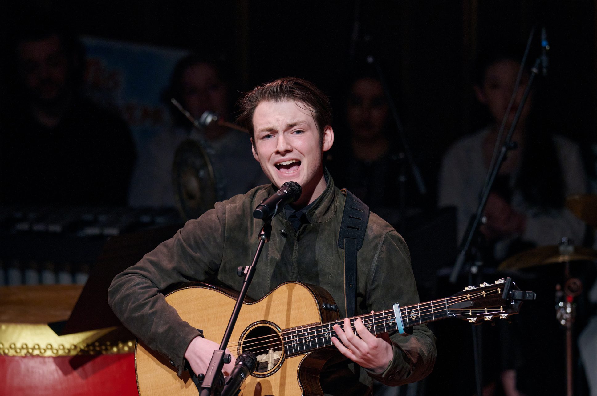 Andy Messier playing acoustic guitar. Andy Messier playing acoustic guitar.