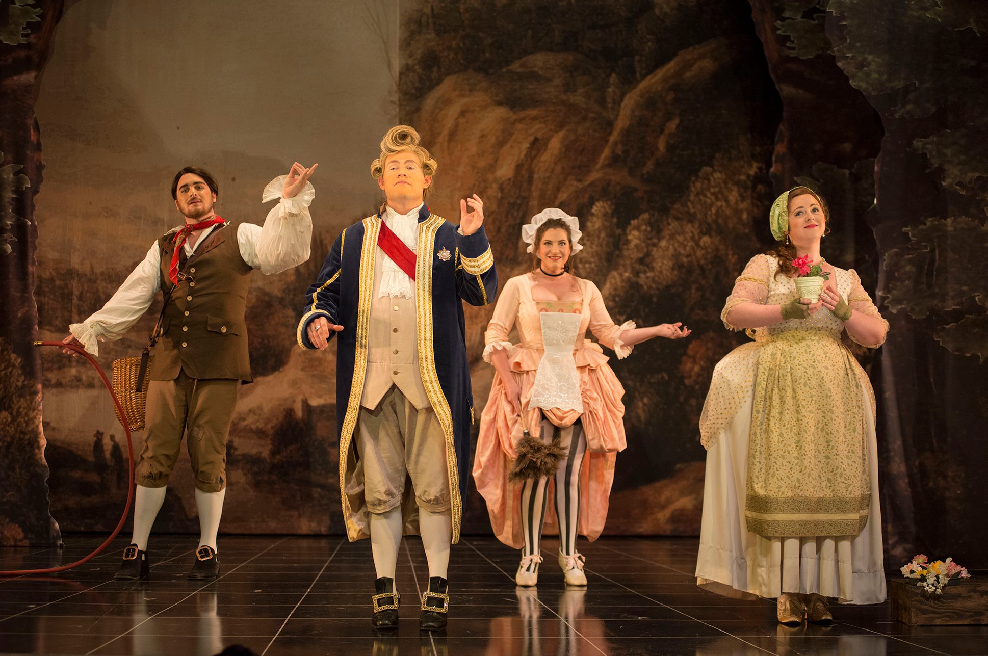 Four opera singers in costume performing Mozart's La Finta Giardiniera. Four opera singers in costume performing Mozart's La Finta Giardiniera.