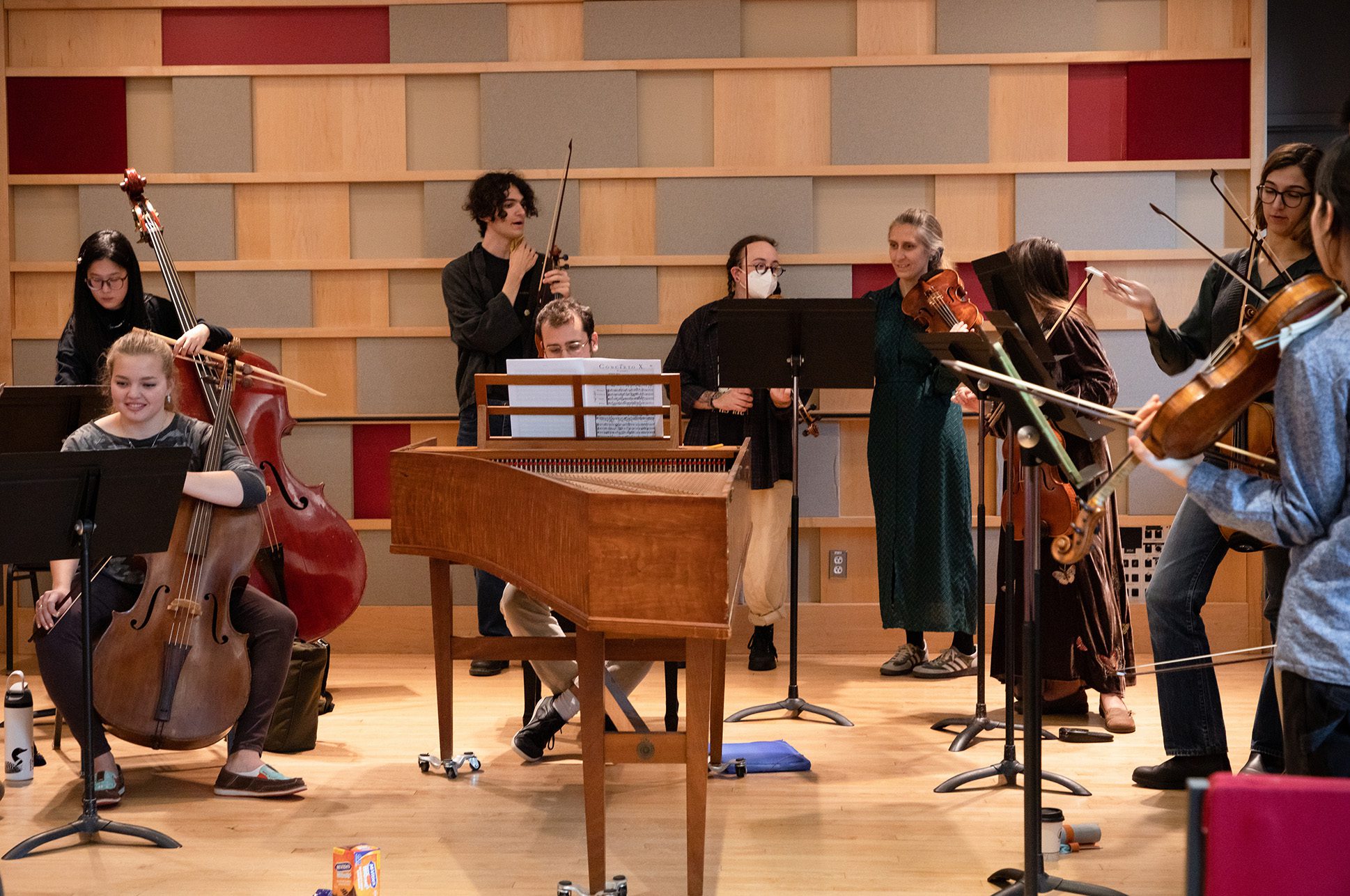 A group of musicians rehearsing as part of an early music ensemble.