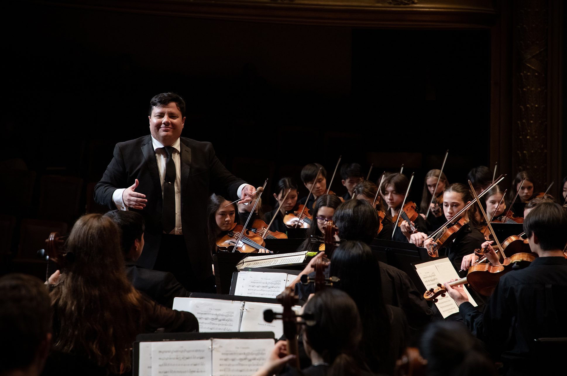 Juliano Aniceto conducting an orchestra. Juliano Aniceto conducting an orchestra.