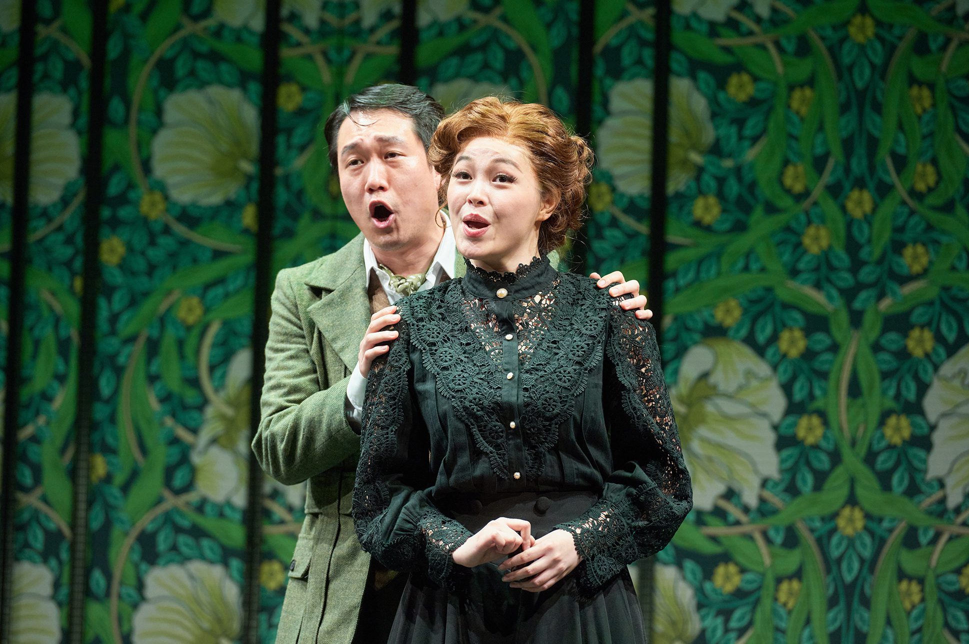 Two opera singers on stage.